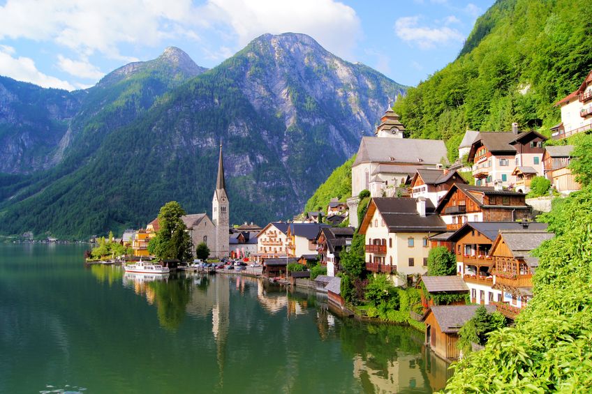 14929845 - famous lake side view of hallstatt village with alps behind, austria
